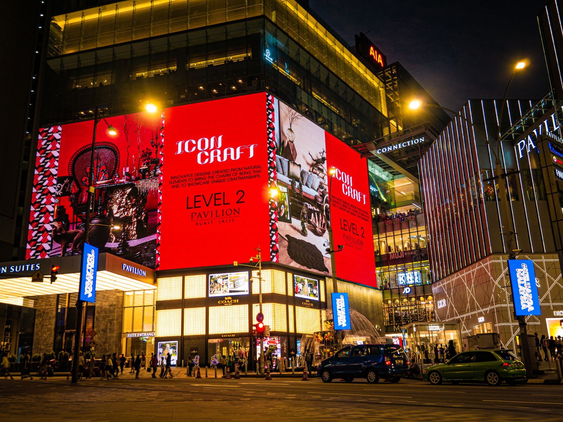 Giant LED screens wrapping a building at night