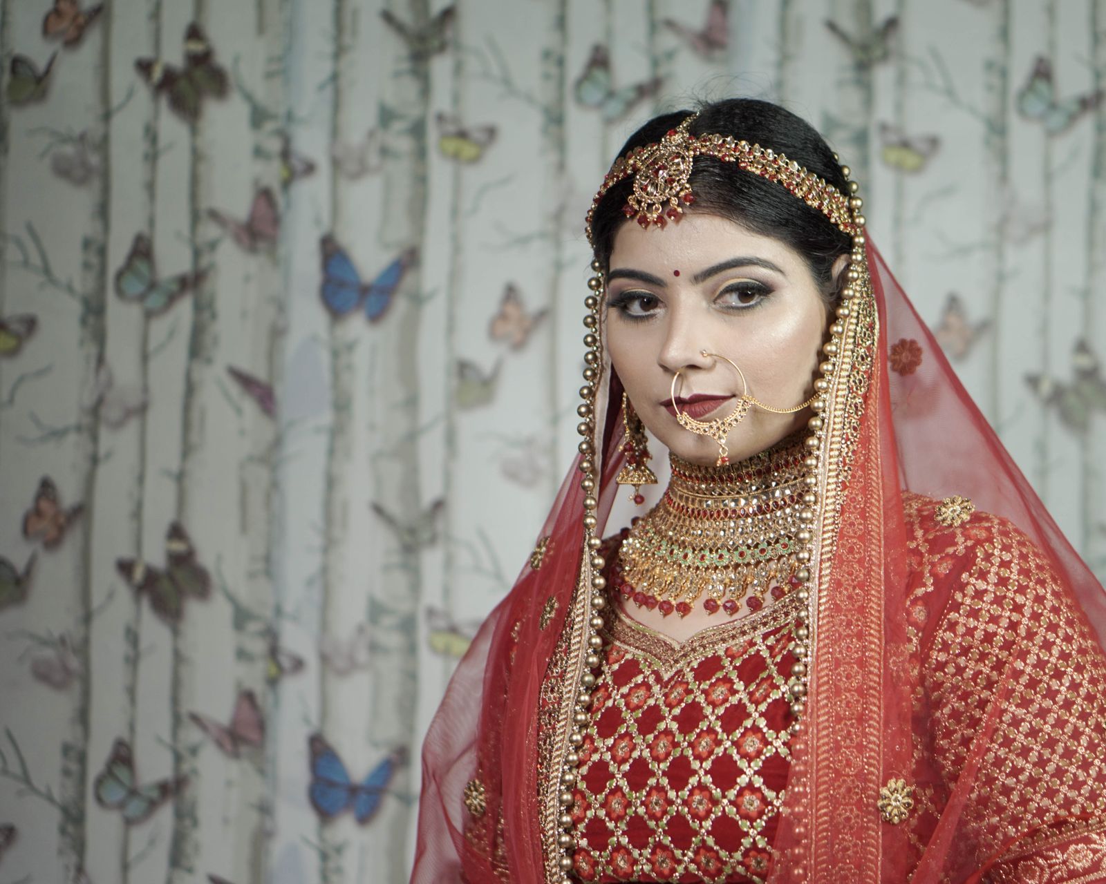 A bride in red with traditional jewellery